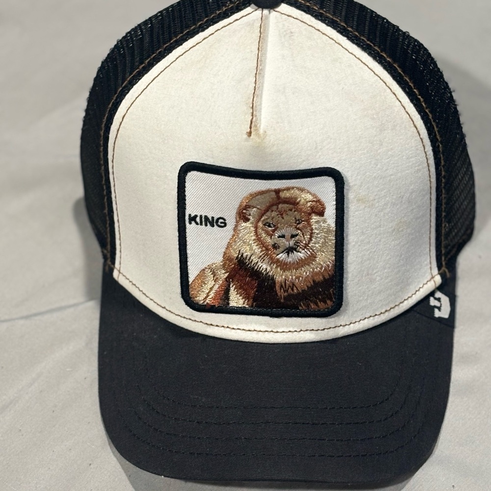 Black and White Trucker Hat with Lion Patch